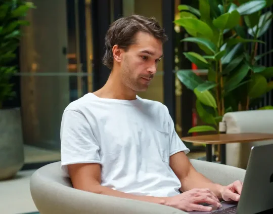 person working with laptop at Liana Helsinki office
