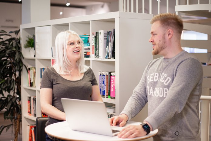 Liana's employees creating newsletters that include polls