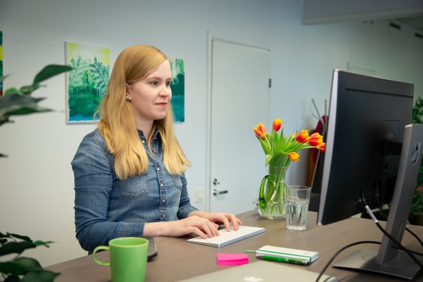 Smiling woman working on her desk 