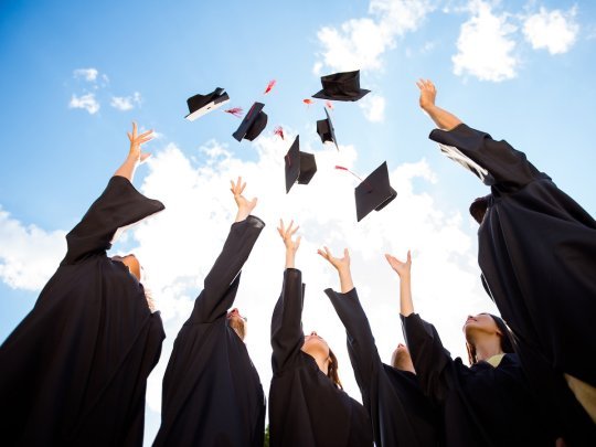 Academic graduates celebrating