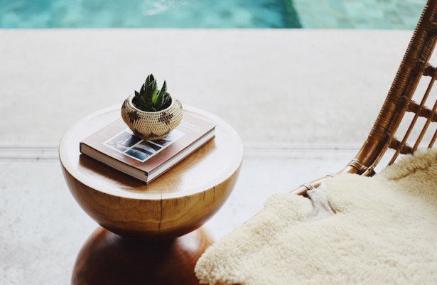 Small plant decoration and book on the table in hotel spa