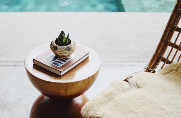 Small plant decoration and book on the table in hotel spa
